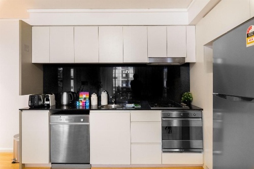 Sleek modern apartment close to everything image 12